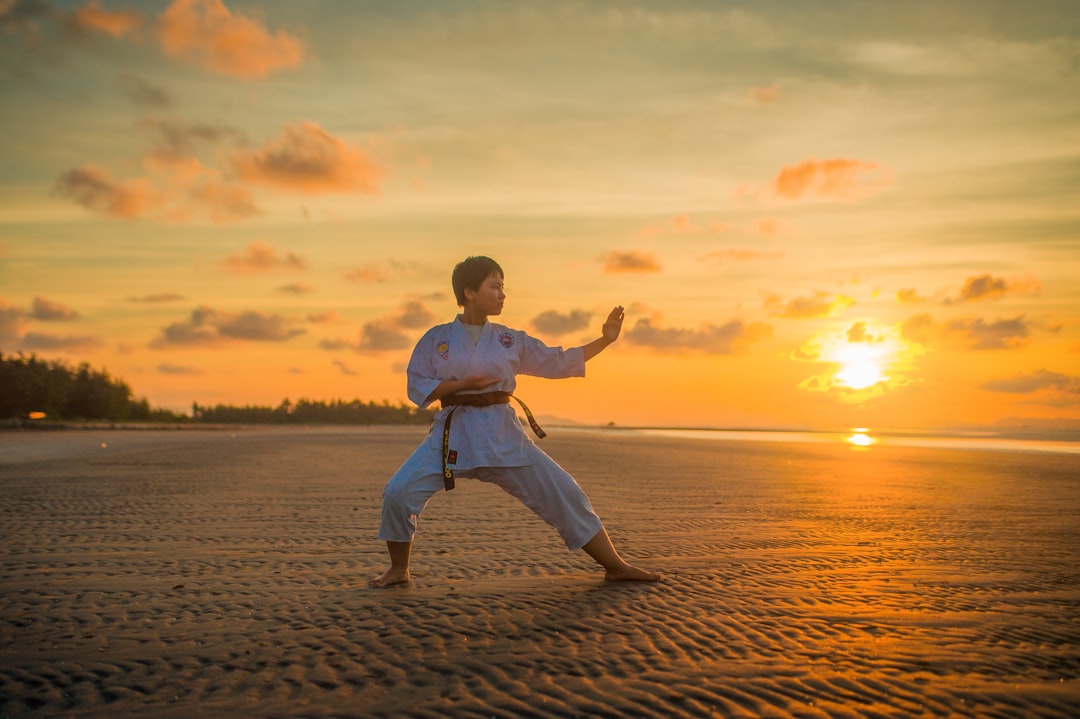 boy-doing-karate-routines-during-golden-hour-iglzpkovznw